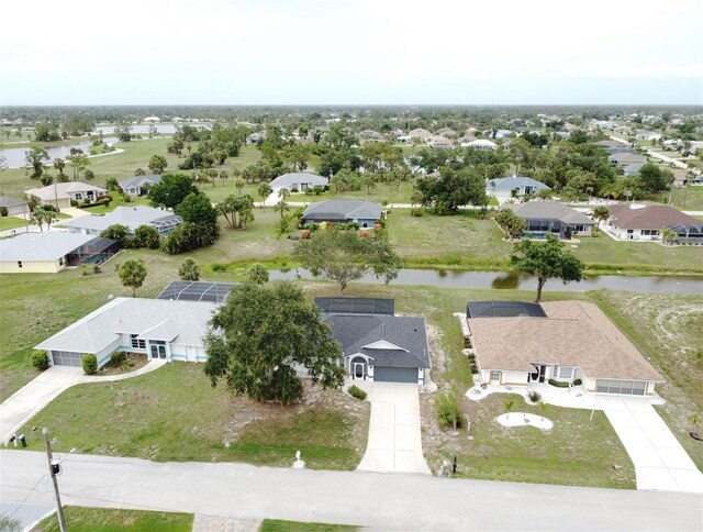 21 Sportsman Way, Rotonda West, FL 33947 - aerial perspective of suburban area with a large body of water