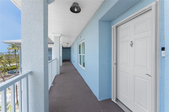 8405 Placida Rd Unit 406, Placida, FL 33946 - doorway to property with stucco siding and a balcony