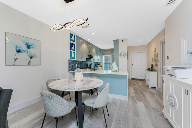 8405 Placida Rd Unit 406, Placida, FL 33946 - dining area featuring light wood-style floors, baseboards, and recessed lighting
