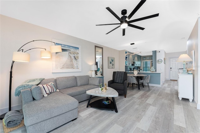 8405 Placida Rd Unit 406, Placida, FL 33946 - living room with a ceiling fan, light wood-type flooring, and baseboards