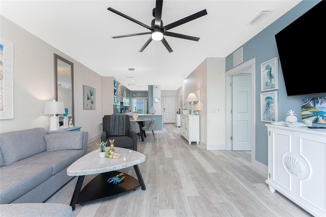 8405 Placida Rd Unit 406, Placida, FL 33946 - living area featuring a ceiling fan, light wood-type flooring, and baseboards
