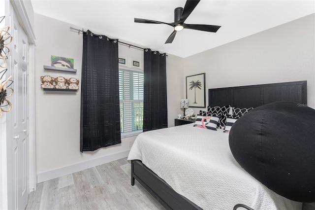 8405 Placida Rd Unit 406, Placida, FL 33946 - bedroom with wood finished floors, ceiling fan, and baseboards