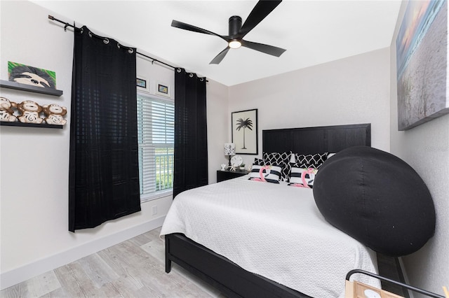 8405 Placida Rd Unit 406, Placida, FL 33946 - bedroom featuring wood finished floors, ceiling fan, and baseboards