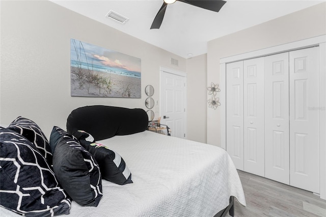 8405 Placida Rd Unit 406, Placida, FL 33946 - bedroom with wood finished floors, a closet, and ceiling fan