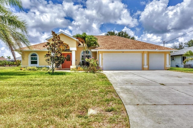 59 White Marsh Ln, Rotonda West, FL 33947 - view of front facade featuring driveway, an attached garage, stucco siding, a front lawn, and central AC unit