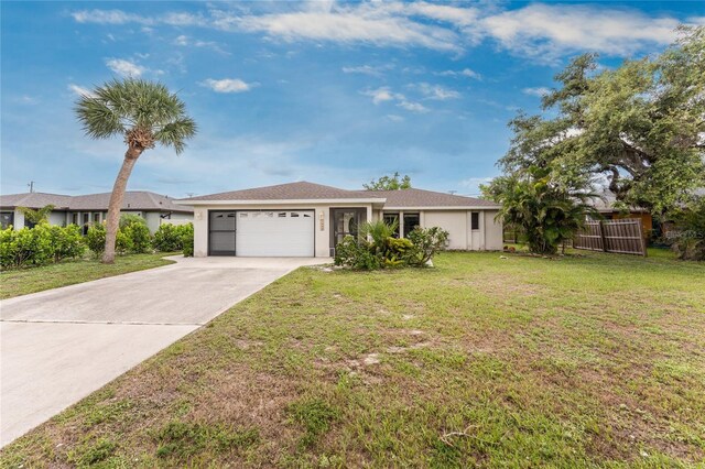 1337 Le Pera Rd, Englewood, FL 34223 - ranch-style home featuring an attached garage, driveway, and stucco siding