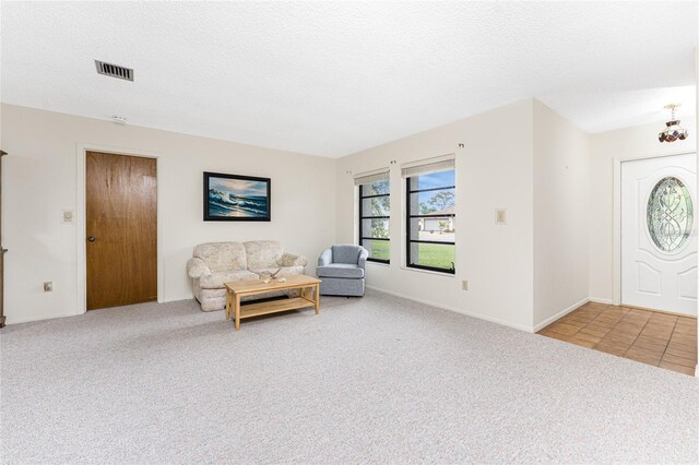 1337 Le Pera Rd, Englewood, FL 34223 - entrance foyer with carpet and a textured ceiling