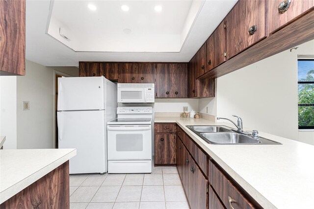 1337 Le Pera Rd, Englewood, FL 34223 - kitchen featuring white appliances, light countertops, a sink, light tile patterned flooring, and recessed lighting