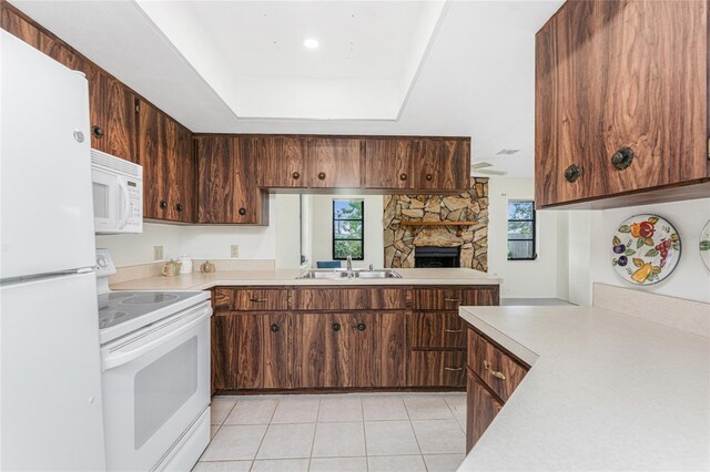 1337 Le Pera Rd, Englewood, FL 34223 - kitchen with white appliances, a sink, light countertops, and light tile patterned floors