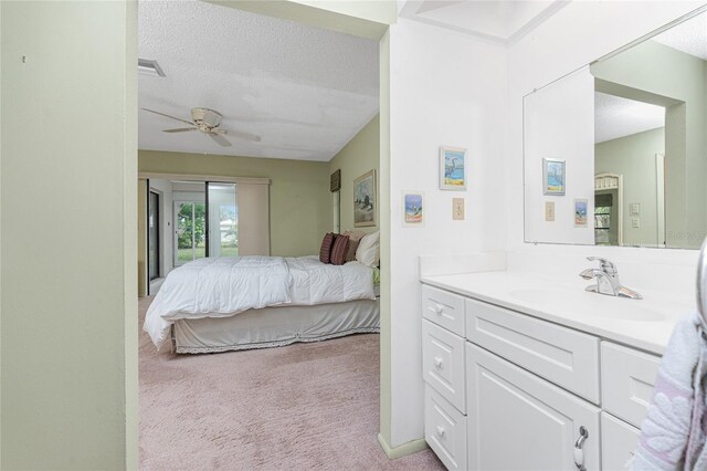 1337 Le Pera Rd, Englewood, FL 34223 - bedroom with a sink, light colored carpet, a textured ceiling, ceiling fan, and access to outside