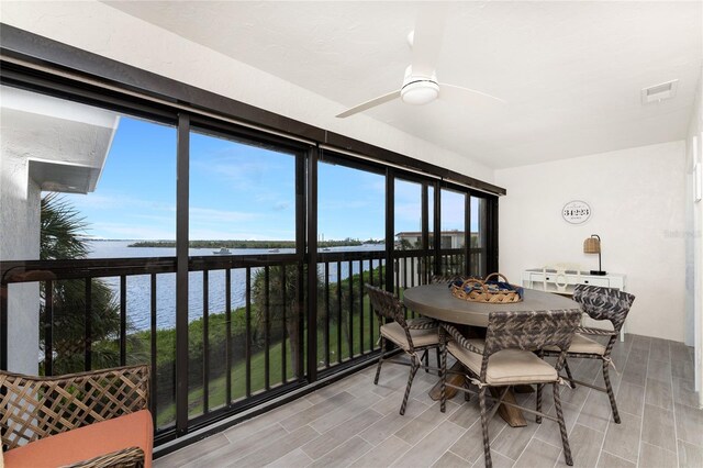 1591 Beach Rd Unit 402, Englewood, FL 34223 - sunroom / solarium featuring a water view