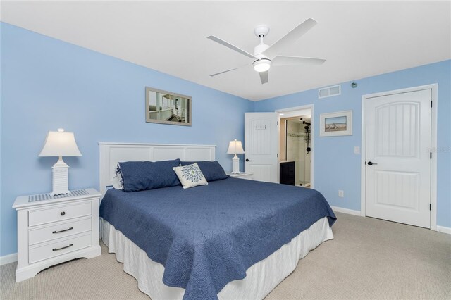 1591 Beach Rd Unit 402, Englewood, FL 34223 - bedroom with light carpet, a ceiling fan, and ensuite bathroom