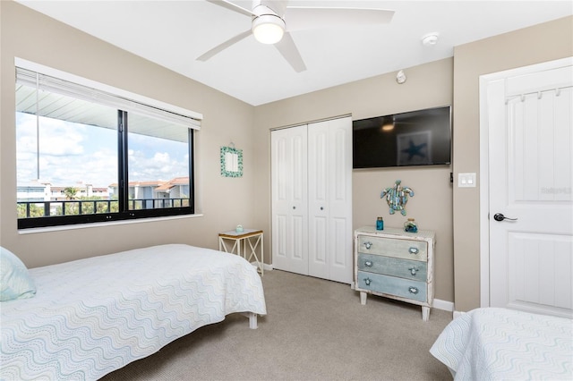 1591 Beach Rd Unit 402, Englewood, FL 34223 - bedroom featuring light carpet, a closet, and a ceiling fan