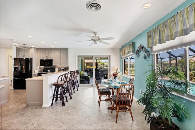 1040 Caples St, Englewood, FL 34223 - dining room with a ceiling fan, light tile patterned flooring, recessed lighting, and baseboards