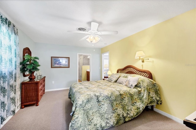 1040 Caples St, Englewood, FL 34223 - carpeted bedroom featuring baseboards, a ceiling fan, and ensuite bathroom