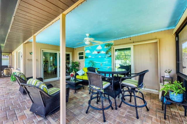 1040 Caples St, Englewood, FL 34223 - view of patio with ceiling fan, outdoor dining space, and outdoor lounge area