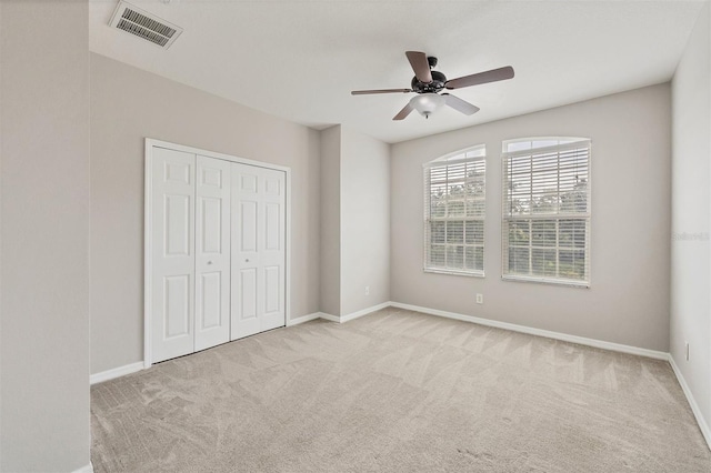 8228 Villa Grande Ct, Sarasota, FL 34243 - unfurnished bedroom with carpet floors, baseboards, a closet, and ceiling fan