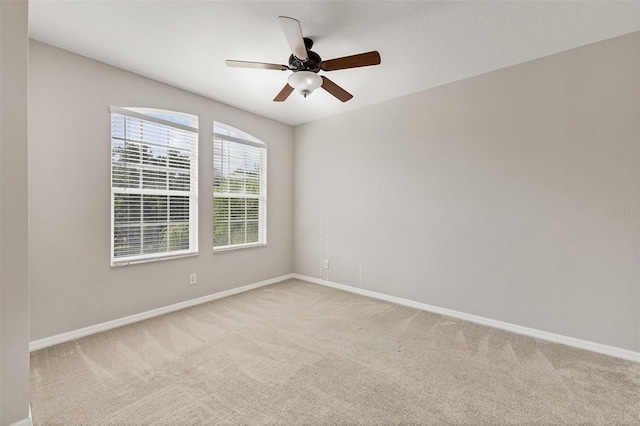 8228 Villa Grande Ct, Sarasota, FL 34243 - empty room with carpet floors, baseboards, and a ceiling fan