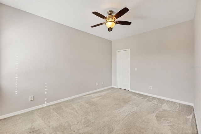 8228 Villa Grande Ct, Sarasota, FL 34243 - carpeted spare room with baseboards and a ceiling fan