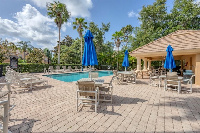8228 Villa Grande Ct, Sarasota, FL 34243 - community pool featuring outdoor dining space and a patio