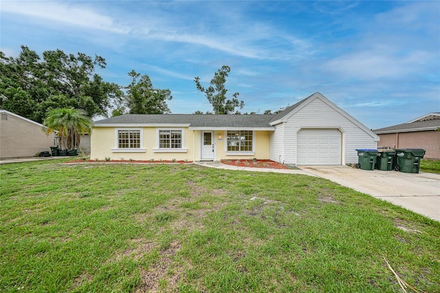 4371 Tollefson Ave, North Port, FL 34287 - ranch-style house with an attached garage, driveway, and a front yard