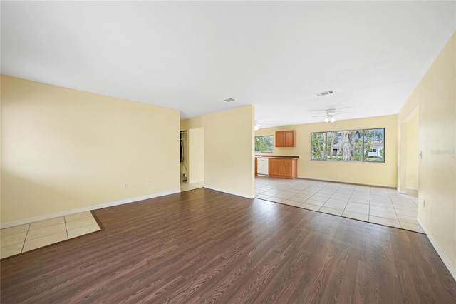 4371 Tollefson Ave, North Port, FL 34287 - unfurnished living room featuring wood finished floors, baseboards, and a ceiling fan