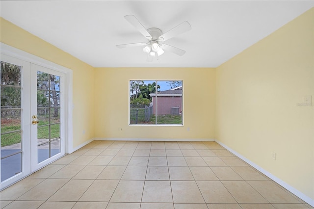 4371 Tollefson Ave, North Port, FL 34287 - spare room featuring french doors, light tile patterned flooring, baseboards, and a ceiling fan
