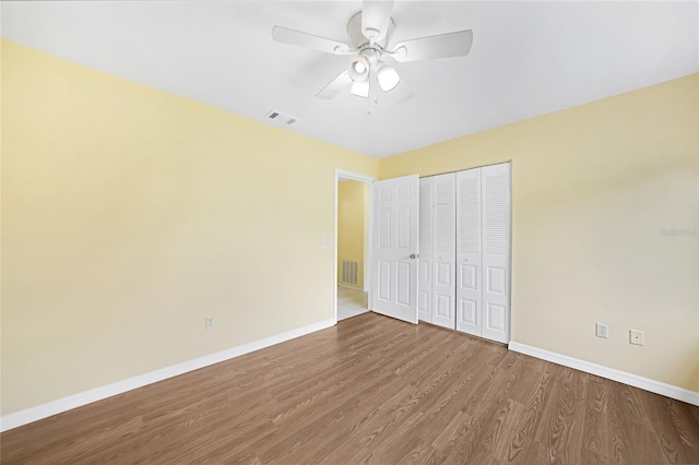 4371 Tollefson Ave, North Port, FL 34287 - unfurnished bedroom featuring baseboards, wood finished floors, a closet, and a ceiling fan