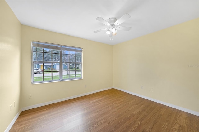 4371 Tollefson Ave, North Port, FL 34287 - unfurnished room with wood finished floors, baseboards, and a ceiling fan