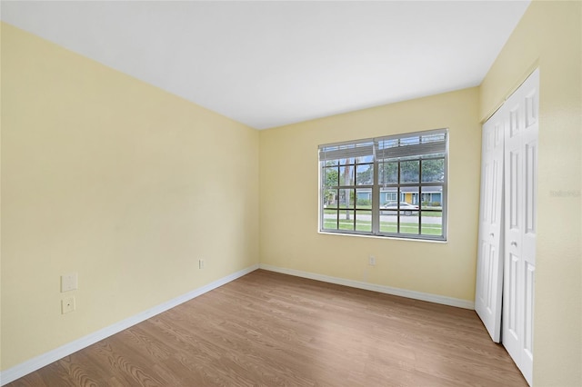 4371 Tollefson Ave, North Port, FL 34287 - unfurnished bedroom with wood finished floors, baseboards, and a closet