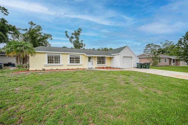 4371 Tollefson Ave, North Port, FL 34287 - ranch-style house featuring driveway, a garage, a front lawn, and stucco siding