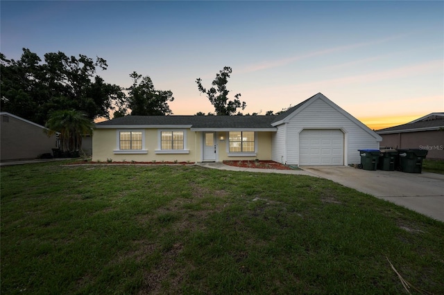 4371 Tollefson Ave, North Port, FL 34287 - ranch-style home with an attached garage, driveway, and a front yard