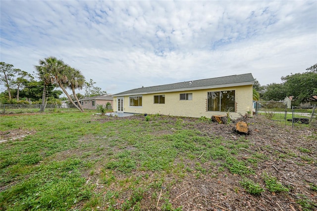 4371 Tollefson Ave, North Port, FL 34287 - back of house with stucco siding and a patio