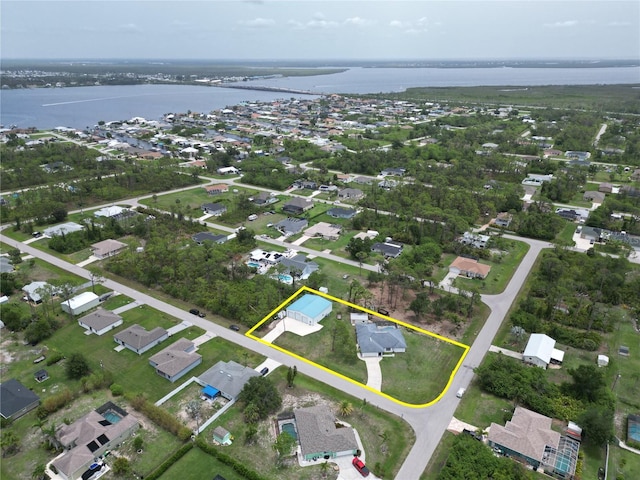 5412 Ulysses St, Port Charlotte, FL 33981 - aerial perspective of suburban area with a nearby body of water and property boundaries highlighted