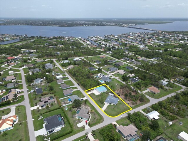 5412 Ulysses St, Port Charlotte, FL 33981 - aerial view of property and surrounding area featuring a nearby body of water, property parcel outlined, and nearby suburban area
