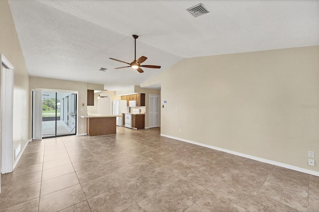 5412 Ulysses St, Port Charlotte, FL 33981 - unfurnished living room featuring a ceiling fan, lofted ceiling, and baseboards