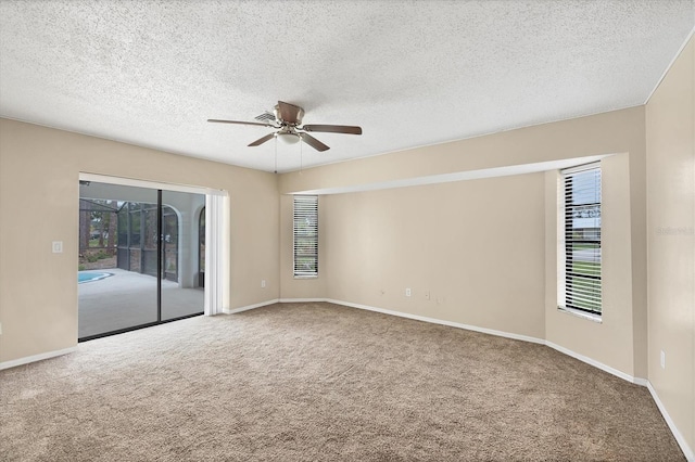 5412 Ulysses St, Port Charlotte, FL 33981 - unfurnished room with a ceiling fan, carpet floors, a textured ceiling, and baseboards