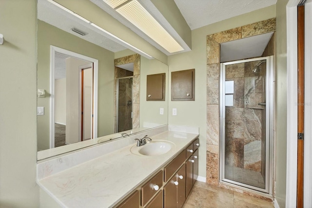 5412 Ulysses St, Port Charlotte, FL 33981 - bathroom with vanity, a shower stall, baseboards, and tile patterned flooring