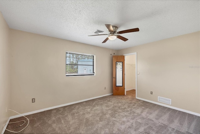 5412 Ulysses St, Port Charlotte, FL 33981 - carpeted empty room featuring a ceiling fan, baseboards, and a textured ceiling