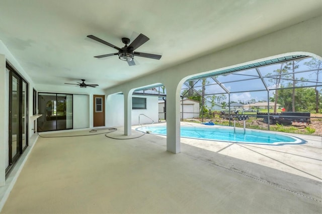 5412 Ulysses St, Port Charlotte, FL 33981 - outdoor pool featuring a patio area, ceiling fan, and glass enclosure