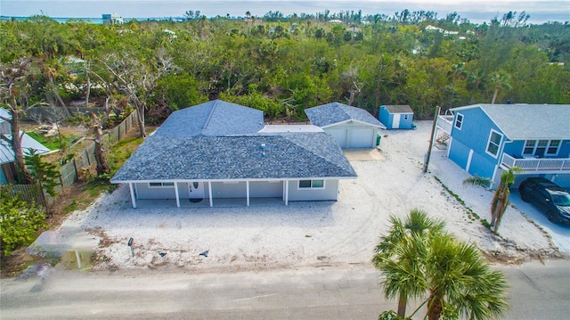608 Saint Judes Dr, Longboat Key, FL 34228 - view of subject property featuring a forest