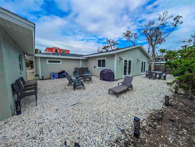 608 Saint Judes Dr, Longboat Key, FL 34228 - back of property featuring french doors and a patio area