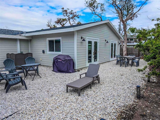 608 Saint Judes Dr, Longboat Key, FL 34228 - back of property featuring french doors and a patio area