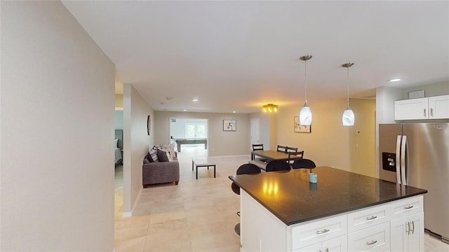 608 Saint Judes Dr, Longboat Key, FL 34228 - kitchen featuring stainless steel refrigerator with ice dispenser, dark countertops, white cabinetry, pendant lighting, and recessed lighting