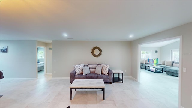 608 Saint Judes Dr, Longboat Key, FL 34228 - living area with healthy amount of natural light, recessed lighting, and baseboards