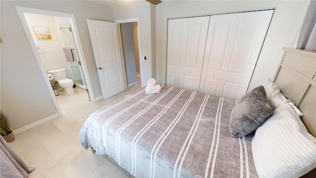 608 Saint Judes Dr, Longboat Key, FL 34228 - bedroom with a closet, baseboards, and connected bathroom