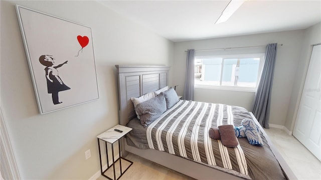 608 Saint Judes Dr, Longboat Key, FL 34228 - bedroom featuring baseboards