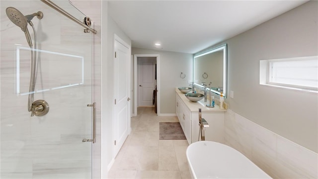 608 Saint Judes Dr, Longboat Key, FL 34228 - full bathroom with a soaking tub, vanity, a stall shower, tile patterned floors, and recessed lighting