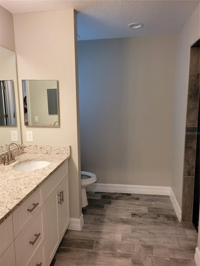 134 Swan Dr, Rotonda West, FL 33947 - full bathroom featuring vanity and wood finished floors