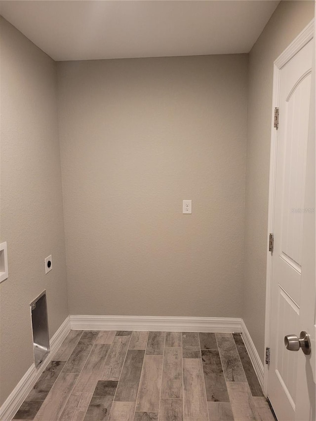134 Swan Dr, Rotonda West, FL 33947 - laundry area with hookup for an electric dryer and dark wood-style floors